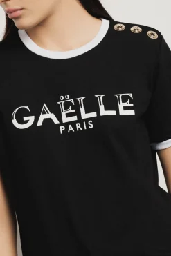 T-Shirt^Gaëlle T-shirt paricollo con stampa logo e bottoni logati oro • - Paris Nero