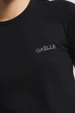 T-Shirt^Gaëlle T-shirt paricollo in bielastico con logo in strass • - Paris Nero